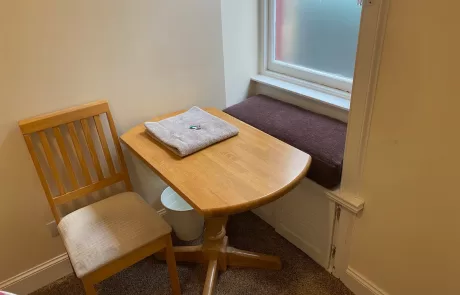 Table and Chair near window in Cozy Room